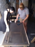 Laying down the perforated metal sheet with Emma. Photo by Adam.