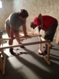 Emma and Adam working on a table.
